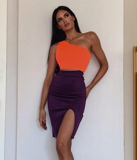 Two color cut-out dress with a high slit detail and midi length